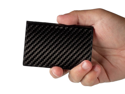 Flexy carbon fiber business card holder being held in a hand