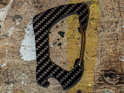 Carbon fiber carabiner with bottle opener