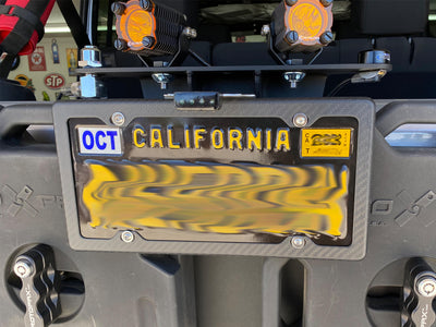 Matte finish carbon fiber license plate frame with 4 holes on 2015 Jeep Wrangler