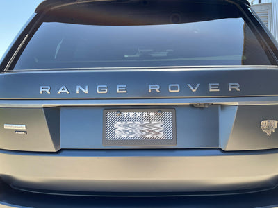 Matte carbon fiber license plate frame on Range Rover Autobiography