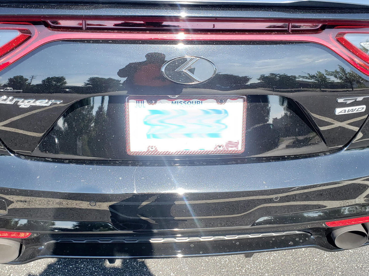 Red carbon fiber aramid fiber/kevlar license plate frame on Kia Stinger GT