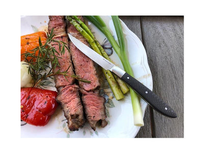 Carbon fiber steak knife, lifestyle with steak