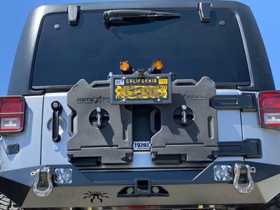 Matte finish carbon fiber license plate frame with 4 holes on 2015 Jeep Wrangler