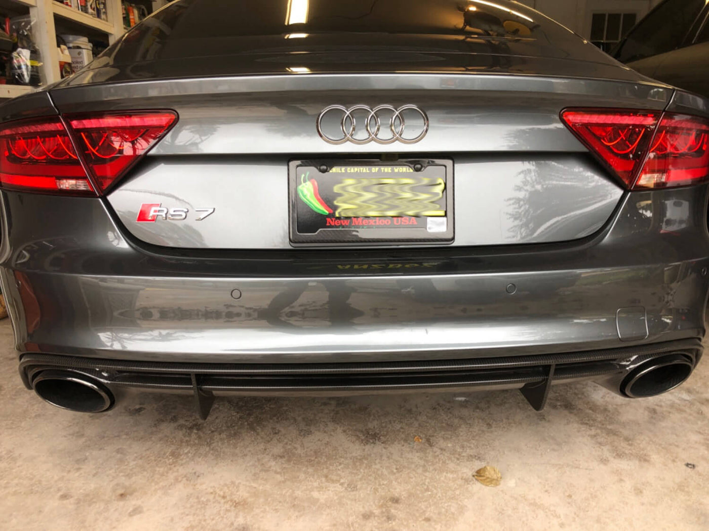 Real carbon fiber license plate frame with 2 holes, angled bottom cutout for stickers on Audi RS7