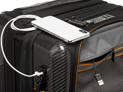 TUMI x McLaren Aero expandable 4 wheel carry-on suitcase, up close charging